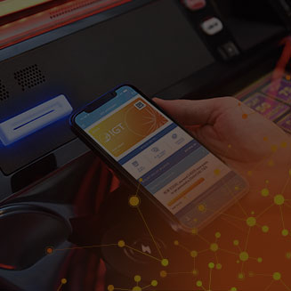 A person paying with their smartphone at a casino using the IGT Advantage resort wallet app