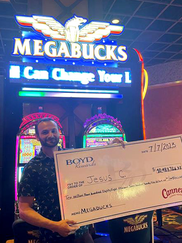 A player holding a check for $10,444,726 from playing IGT's MEGABUCKS wide area progressives slot game at a casino. 